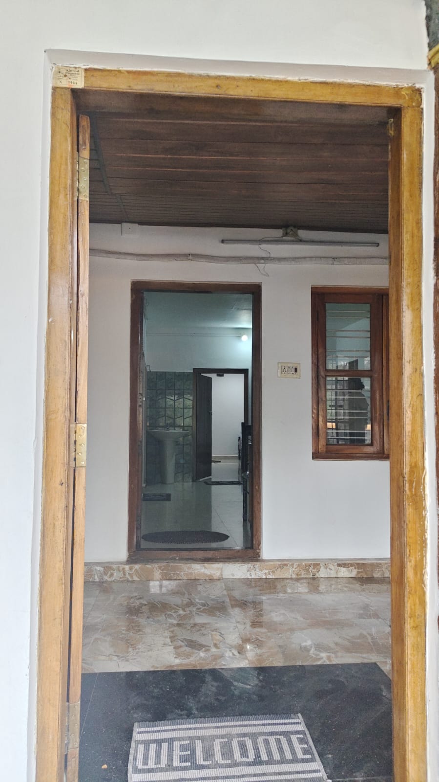 Inside the cottage entrance at Dharshana