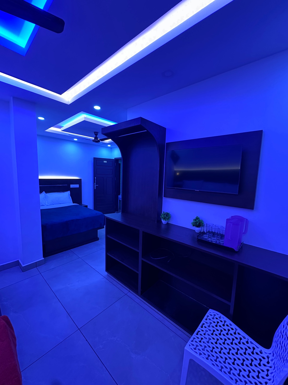 Sitting area inside the G Mount Luxury deluxe family room, with a second bedroom beyond