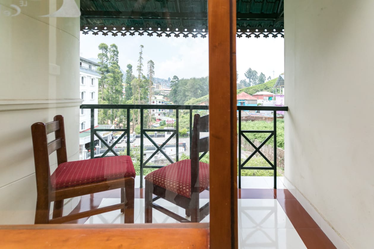 Balcony at Le Celestium looking over Munnar town and the hills