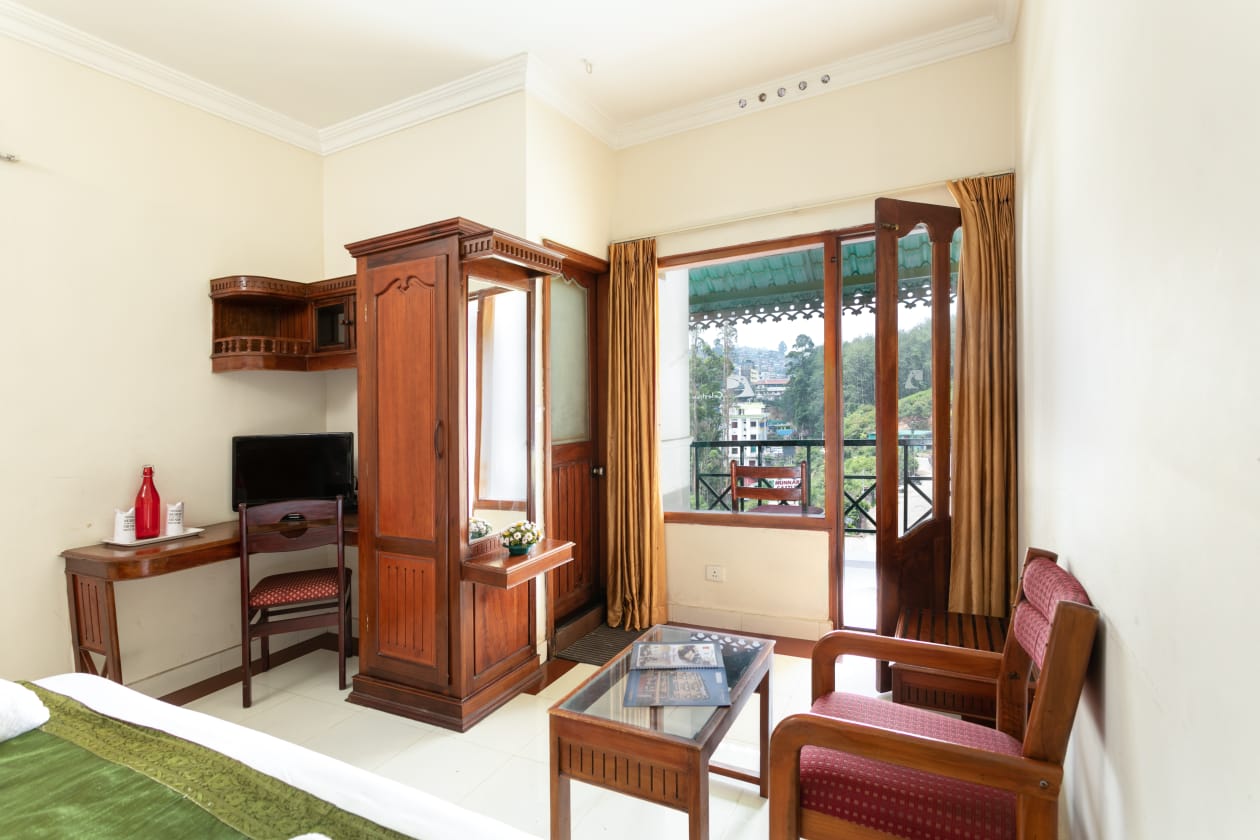 Inside a Le Celestium room with balcony doors open
