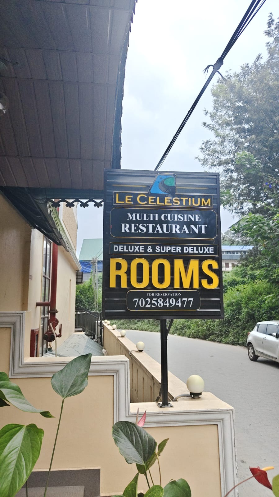 Le Celestium signboard outside the hotel in Munnar