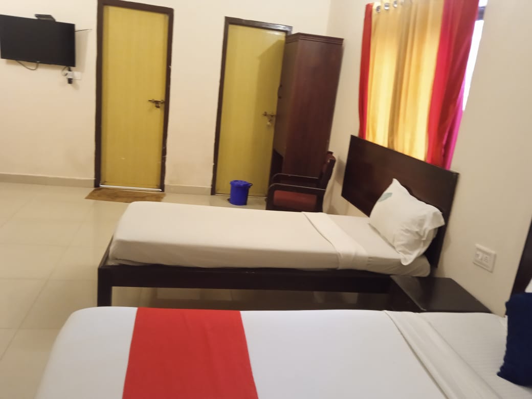 Inside the Lumino Karthika family room showing the wardrobe and television